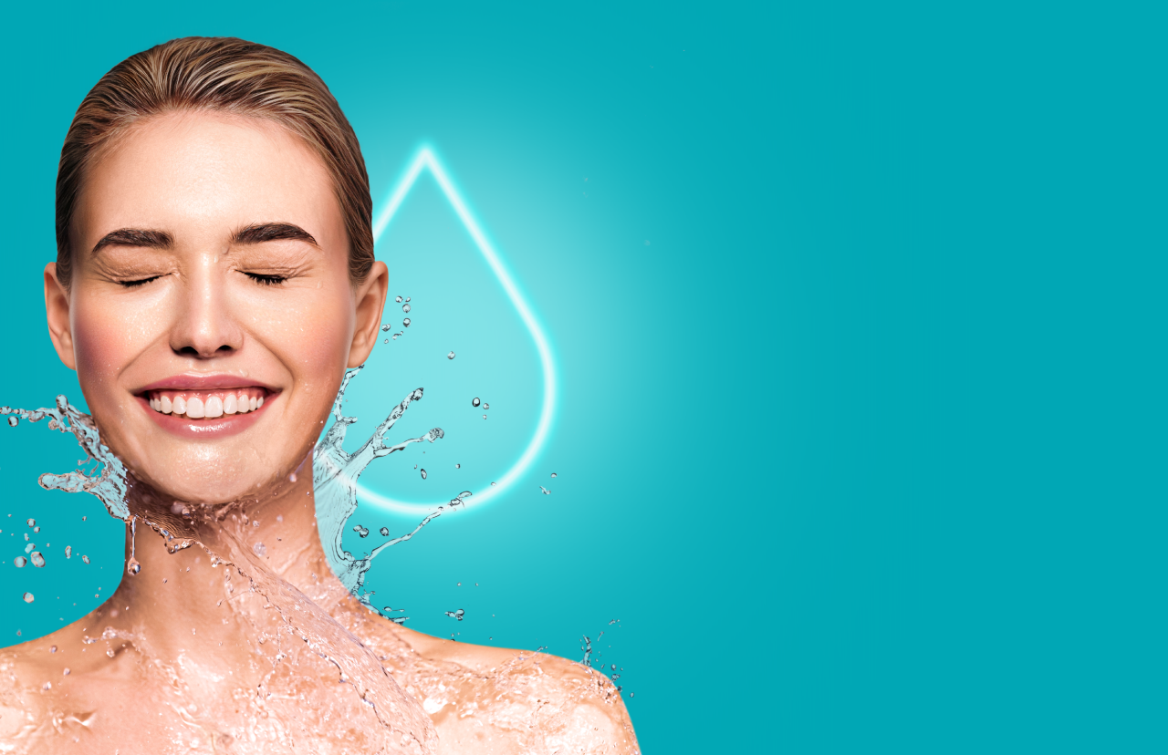 Headshot of SKINVIVE™ patient Anna smiling joyfully, with a glowing droplet in the background.